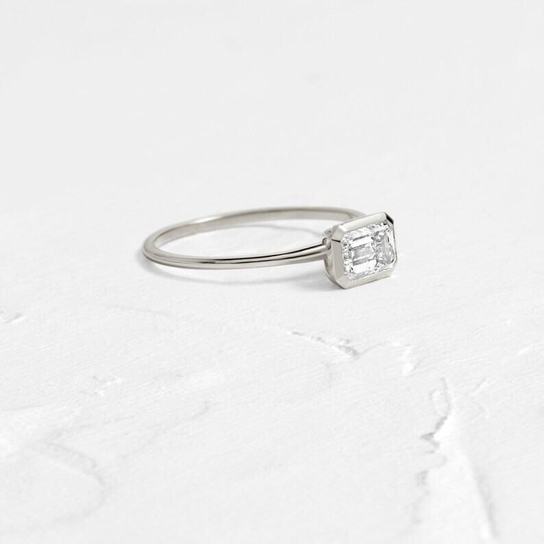 East West Emerald Cut Moissanite Engagement Ring Bezel Set Emerald Cut Wedding Ring 14K Solid Gold Lab Grown Diamond Anniversary Ring.